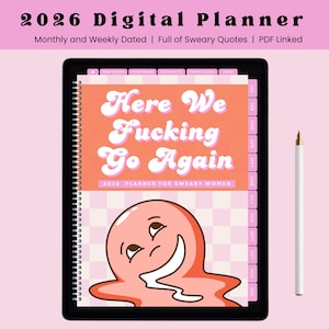 May include: A digital planner on a black tablet with the text "Here We Fucking Go Again." The planner is dated for 2026 and includes monthly and weekly views. A white stylus with a gold tip rests beside the tablet. The background is pink.