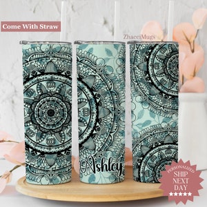 May include: Three stainless steel tumblers with a teal blue background and black mandala design. The middle tumbler has the name "Ashley" written in black cursive. The tumblers come with a straw.