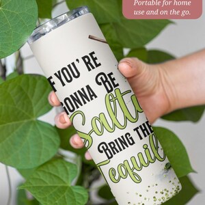 May include: A 20 ounce stainless steel tumbler with a white background and green text that reads "If you're gonna be salty bring the tequila".
