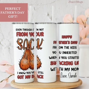 May include: Three white tumblers with a humorous Father's Day message. The first tumbler says "Even though I'm not from your sack, I know you've still got my back". The second tumbler says "Happy Father's Day from the kids you inherited when you started shacking up with my mom". The third tumbler says "Love, Sarah".