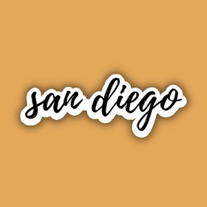 May include: A black and white sticker with the text "san diego" written in cursive.