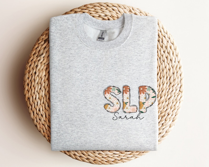 a t - shirt with the word slp on it