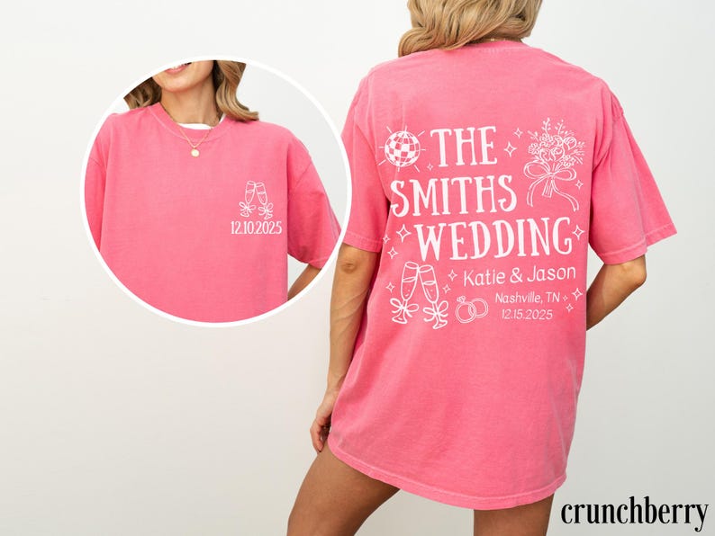 A woman wearing a pink t-shirt with white text and graphics on the back.