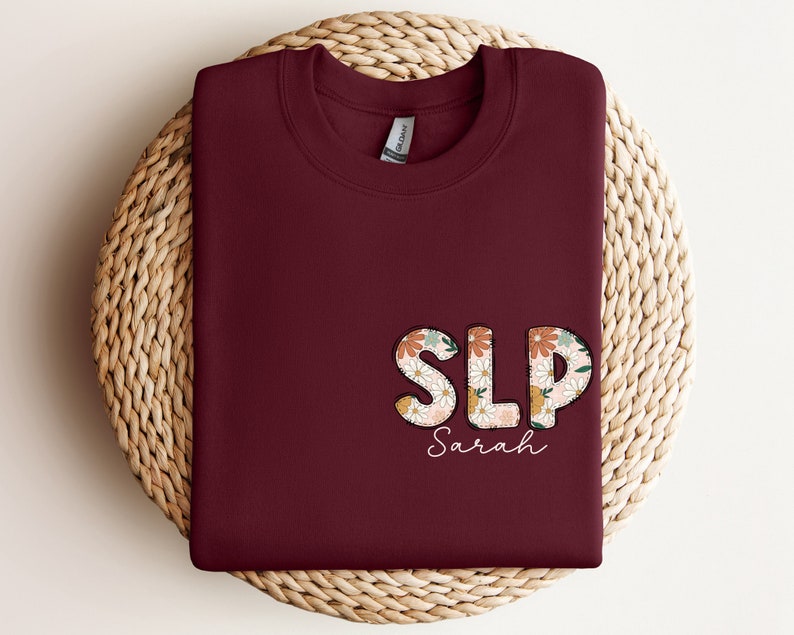 a red shirt with the word slp on it