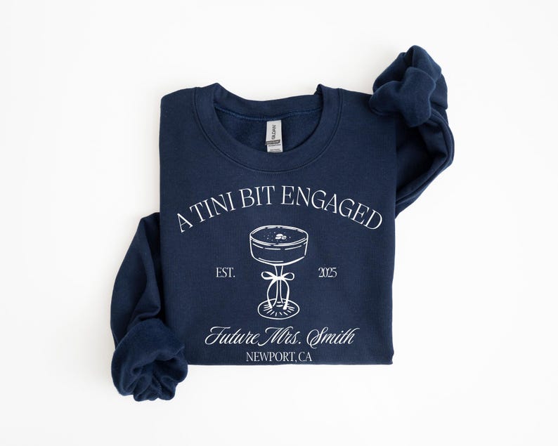 A navy blue sweatshirt with white text and graphics printed on it.