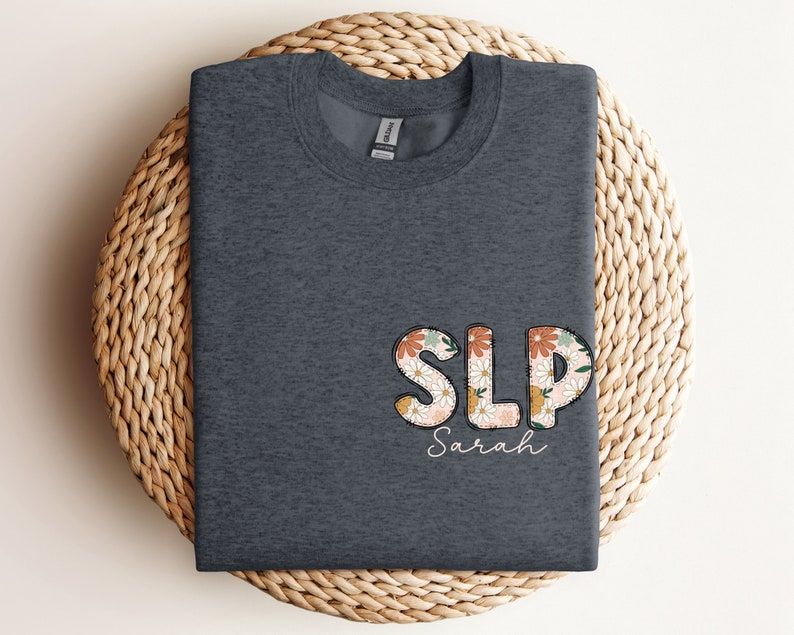 a t - shirt with the word slp printed on it