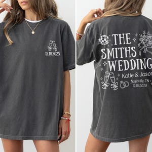 a woman wearing a gray t-shirt with white text and graphics printed on the back. The text on the t-shirt reads "THE SMITH'S WEDDING" and includes the names "Katie & Jason" and the date "12/10/2025".