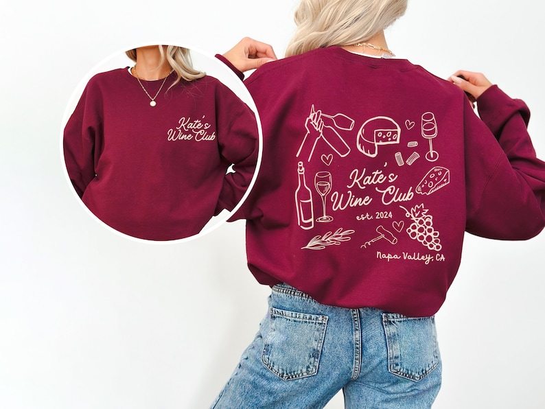a woman wearing a red sweatshirt and jeans