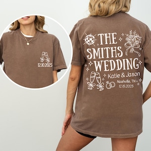 a woman wearing a brown t-shirt with white text and graphics on the back.