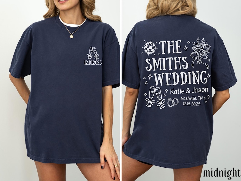 A woman wearing a navy blue t-shirt with white text and graphics printed on the back.