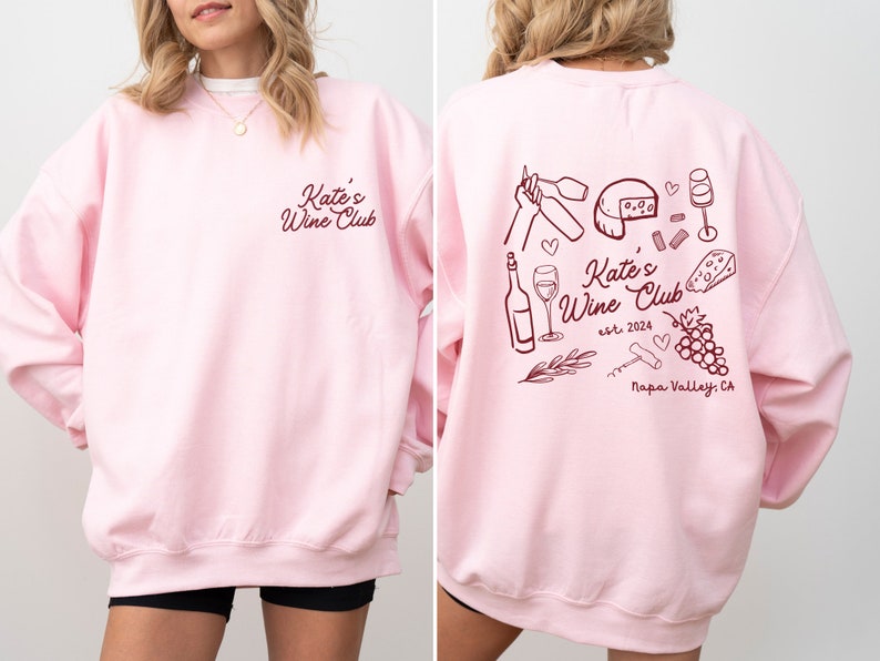 a woman wearing a pink sweatshirt and shorts