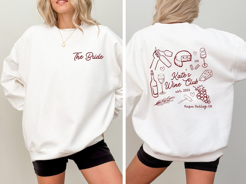 a woman wearing a white sweatshirt with the words the bride on it