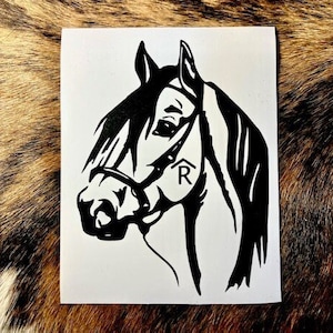 May include: Black and white silhouette of a horse's head with a bridle and the letter "R" on the side.