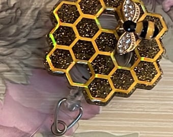 Honeycomb badge reel with  glitter background and bee charm