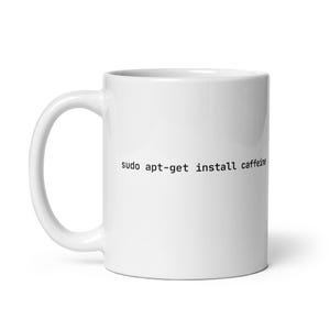 May include: White ceramic coffee mug with the text "sudo apt-get install caffeine" printed on the front.