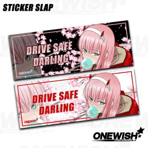 May include: Two rectangular sticker slaps featuring anime-style illustrations. The stickers display a pink-haired character with green eyes blowing a bubble. Text on the stickers reads "DRIVE SAFE DARLING" and "ONEWISH".