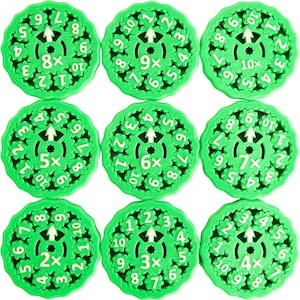 May include: Nine green plastic circular number dials with white numbers and arrows. Each dial has a different number of teeth and a multiplier printed in the center. The multipliers are 2x, 3x, 4x, 5x, 6x, 7x, 8x, 9x, and 10x.