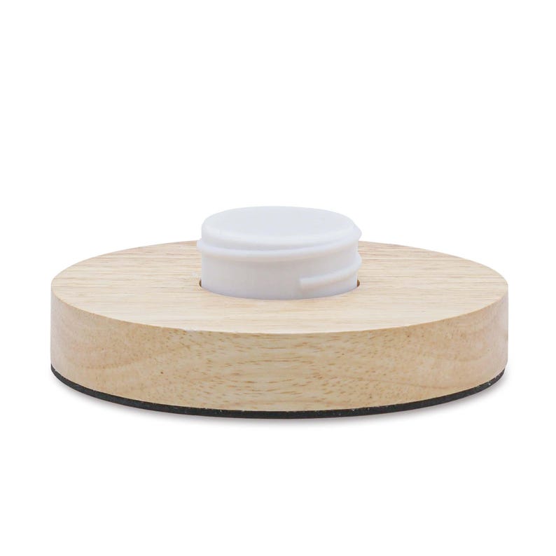 May include: A round wooden base with a black edge and a white plastic lid in the center.