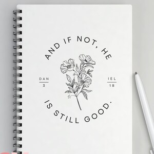May include: A white spiral bound notebook with a black and white floral design and the text "AND IF NOT, HE IS STILL GOOD."  The text "DAN 3" and "IEL 18" are also included in the design.