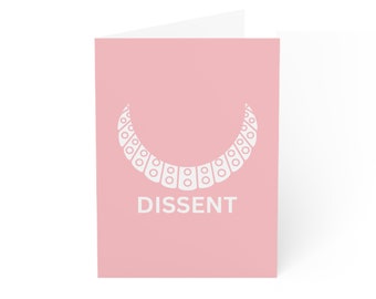 May include: A pink card with a white necklace design and the word "DISSENT" printed below it.