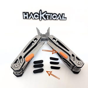 May include: A multi-tool with a silver and black finish, featuring orange accents. The tool is open, displaying pliers and a knife. The word "HACKTICAL" is above the tool. Three black rubber grips are also included.