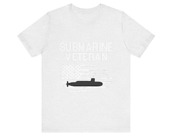 May include: A grey t-shirt with the text "SUBMARINE VETERAN" in white lettering. An American flag with a silhouette of a submarine is below the text.