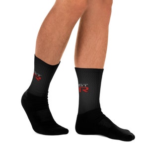 May include: Black socks with a red and gray "GT-R" logo on one sock.