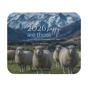 May include: A rectangular image featuring a scenic mountain backdrop with text that reads "2026 happy are those conscious of their spiritual need." Several sheep stand in a grassy field in the foreground.