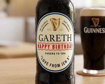 May include: A dark brown glass bottle with condensation droplets and a custom oval label featuring the Guinness logo, the name GARETH, the text HAPPY BIRTHDAY, CHEERS TO YOU, and LOVE FROM JEN X, accompanied by a glass of dark stout beer.