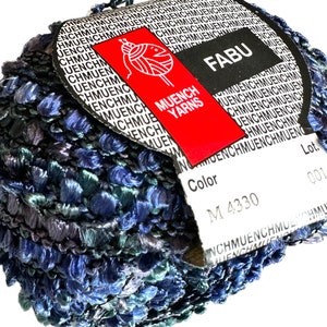 May include: A skein of blue and green yarn with a white label that says "FABU" and "MUENCH YARNS". The label also includes the color number "M 4330" and the lot number "001".