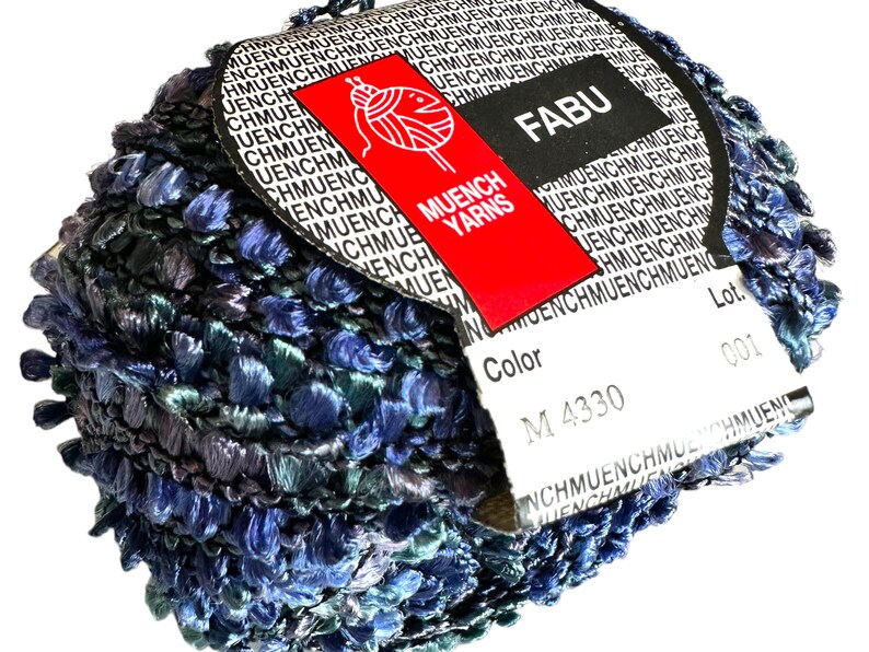May include: A skein of blue and green yarn with a white label that says "FABU" and "MUENCH YARNS". The label also includes the color number "M 4330" and the lot number "001".