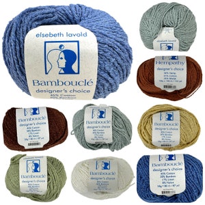May include: A collection of 10 skeins of yarn in various colors, including blue, green, brown, beige, and white. Each skein is labeled "Bambouclé designer's choice" and lists the yarn composition: 45% cotton, 30% bamboo, 17% linen, and 8% nylon. One skein is labeled "Hempathy designer's choice" and lists the yarn composition: 34% hemp, 41% cotton, and 25% modal. Each skein is 50 grams and 80 meters long.
