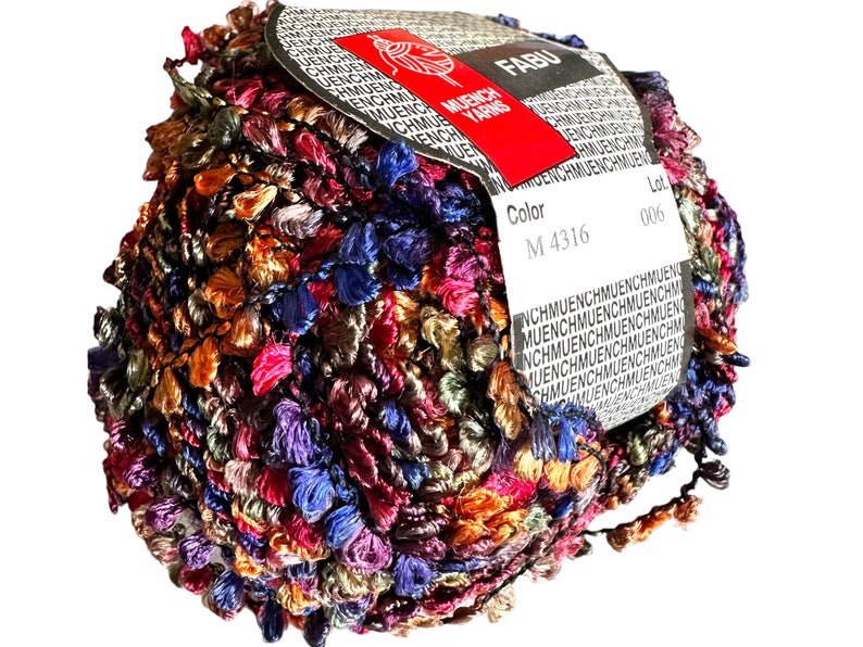 May include: A ball of multicoloured yarn with a label that reads "FABU" and "Muench Yarns". The label also includes the colour code "M 4316" and the lot number "006".