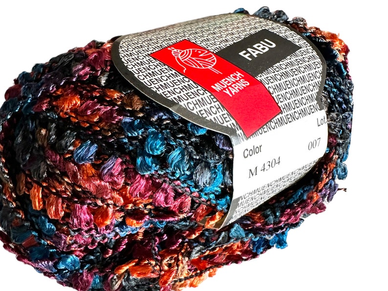 May include: A skein of multicolored yarn with a label that reads "FABU" and "MUENCH YARNS". The label also includes the color code "M 4304" and the lot number "007".