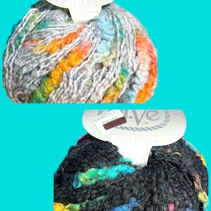 May include: Two balls of colourful yarn. One is grey with rainbow accents, the other is black with rainbow accents. Each ball has a tag that says "Laureen" and "Ewe & Eye".