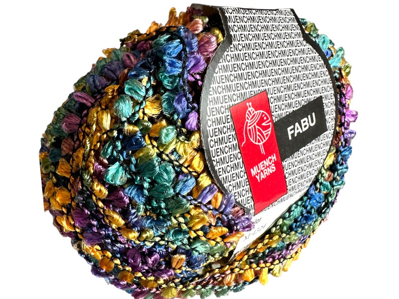 May include: A skein of multicoloured yarn with a fringe. The yarn is a mix of purple, teal, gold, and black. The label reads "FABU" and "MUENCH YARNS".