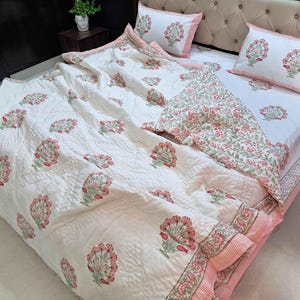 Cottage core bedding featuring blush pink floral bedspread with lightweight cotton filling