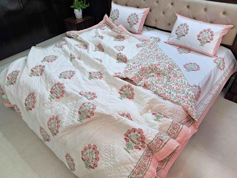Cottage core bedding featuring blush pink floral bedspread with lightweight cotton filling
