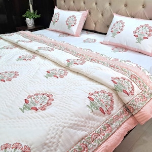 Reversible Jaipuri razai with pink floral hand block print and soft cotton quilting details
