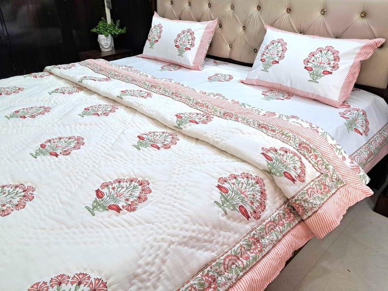 Reversible Jaipuri razai with pink floral hand block print and soft cotton quilting details