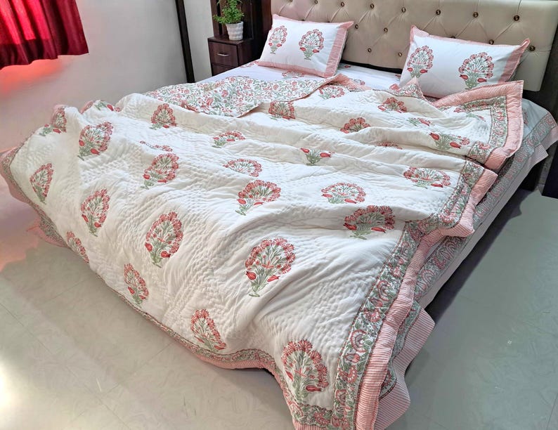 Indian handmade cotton comforter with traditional block print floral pattern and quilted texture