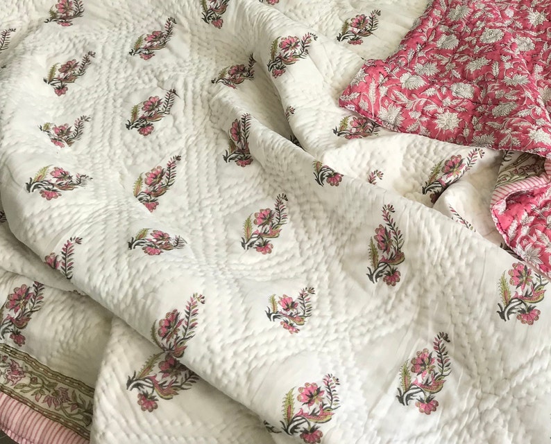 Vintage floral pink cotton quilt with hand block printed botanical pattern, reversible cotton throw blanket, cottagecore bedspread, boho bedding, handmade Indian quilt in soft pink tones.