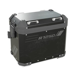 May include: A black rectangular motorcycle side case with reinforced gray corner protectors and metal latches. The side panel features the text R 1250 ADVENTURE in white lettering, overlaid on a subtle world map graphic with additional white stripes.