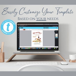 May include: A laptop displays a template with the text "Sips and Dips!" and "Easily Customize Your Template." The laptop sits on a wooden stand on a white desk, with a cup, speakers, and a pen holder nearby. The template features a wine bottle and cheese.