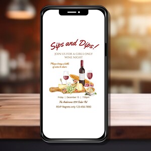 May include: A smartphone displays a wine night invitation. The invitation features the text "Sips and Dips!" and "Join us for a girls only wine night." An illustration of wine, cheese, and bread is also included. The date is December 15th at 7:00 PM.