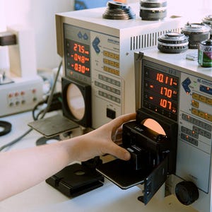 Nikon L35AD (Pikaichi) film camera being tested on a Kyoritsu Arrowin EF8000 with an adjacent EF-5 Shutter Tester, showing the equipment and testing process.