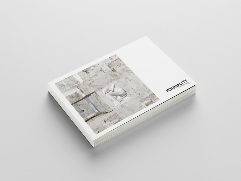 May include: A white book with a marble pattern on the cover. The book is titled "FORMALITY" and is stacked on a white surface.