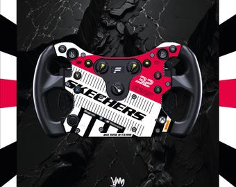 May include: A racing steering wheel controller featuring a white and red colour scheme with the text SKECHERS, the number 32, and the phrase WE ARE A TEAM. The device includes various buttons, knobs, and a central display screen on a black frame.