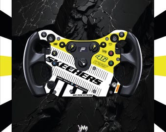 May include: A racing steering wheel controller featuring a yellow and white faceplate with the text SKECHERS, the number 46, and WE ARE A TEAM. The device includes black grips, various circular buttons labelled with letters, and a central dial.