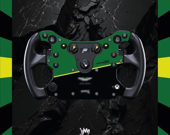 May include: A black and green racing wheel with yellow detailing. The wheel has various buttons and a central control panel. The background is a textured black surface with a green and yellow border.